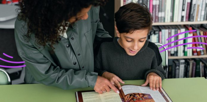 Feature-teacher-giving-reading-strategies-to-student-696x345