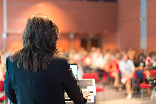 depositphotos_97632222-stock-photo-business-woman-lecturing-at-conference
